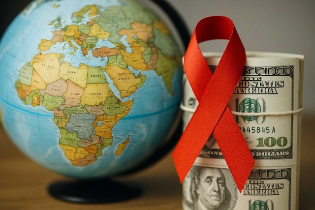 Medical professionals discussing HIV treatment plans amid foreign aid cuts