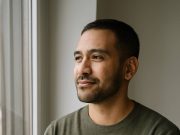 Living with HIV: What They Won’t Tell You Person with HIV reflecting on life while holding medication.