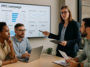 The Value of PPC Campaigns in Modern Pharma Marketing Pharma marketers reviewing PPC campaign data on a screen during a strategy meeting.