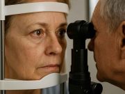 Do your Patients Understand the Term Diabetic Retinopathy Doctor and patient reviewing a diabetic retinopathy chart in clinic