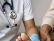 Diabetic Wound Care: The Importance of Checking Patient’s Toes Doctor inspecting toes for diabetic wound care during patient visit
