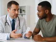 HIV Drug Treatment: What You Need to Know Doctor reviewing HIV medication plan with a patient in clinic.