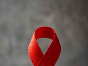 Why We Should All Care about HIV and AIDs Red ribbon representing HIV and AIDS awareness.